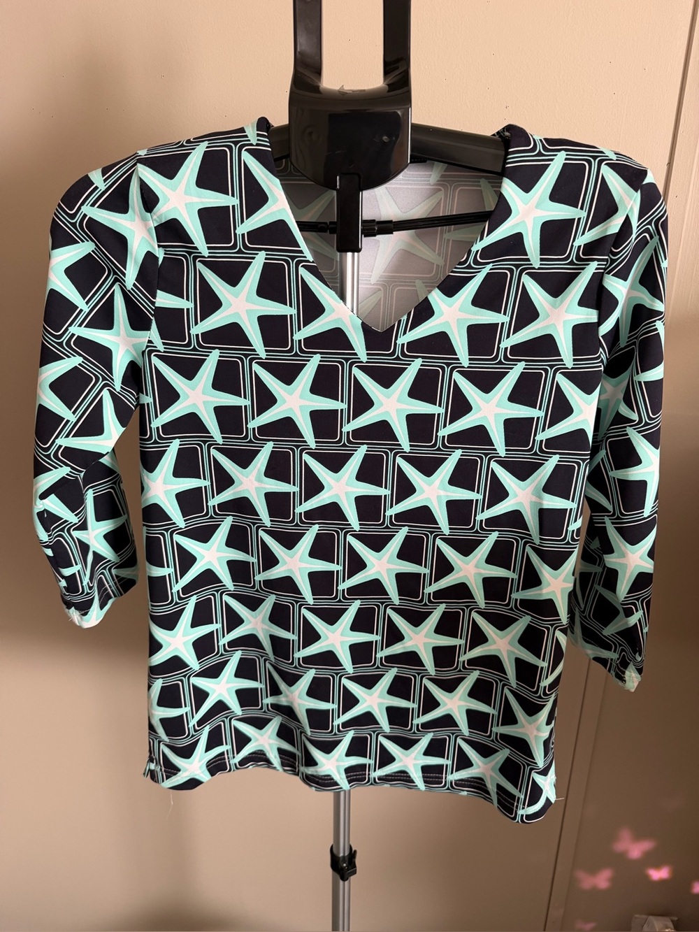 Lulu-B top starfish and geometric square print in a mint green and black